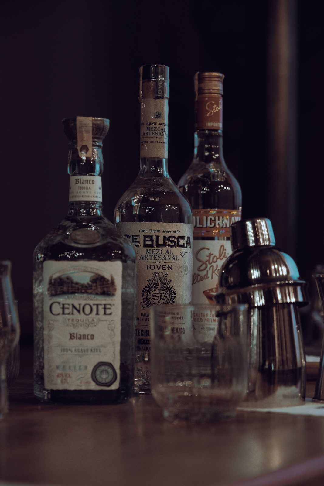 Clear vodka bottle and glass